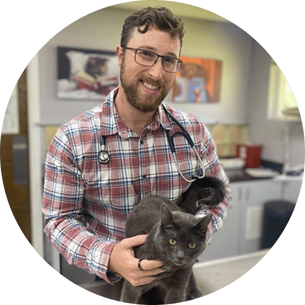 Dr Evans with cat circle Headshot
